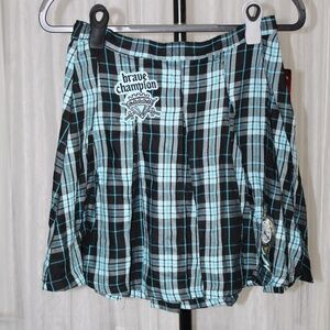 Disney Descendants girls' pleated skirt in a black and blue plaid pattern.